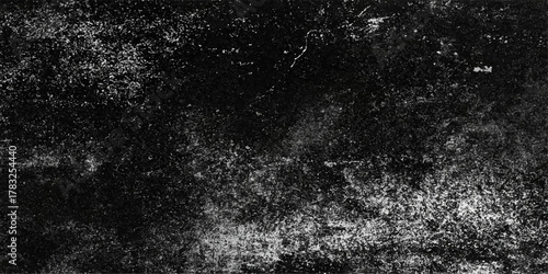 Dirty old black and white grunge asphalt texture pattern with a rough surface