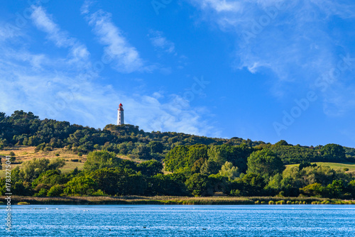 Fototapeta Naklejka Na Ścianę i Meble -  A view of the lighthouse from the island of Hiddensee on the Baltic Sea