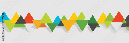 Abstract geometric pattern of colorful overlapping triangles creating a dynamic wave effect on a light background.
