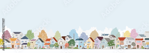 A charming row of colorful houses and trees under a clear sky, representing a peaceful neighborhood.