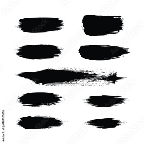 A collection of black brush strokes on white paper art vector design