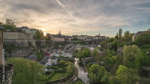 Grand Duchy of Luxembourg time lapse 4K, city skyline day to night sunset timelapse at Grund along Alzette river in the historical old town of Luxembourg