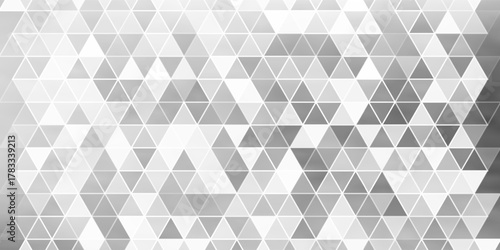 Abstract geometric pattern creates a modern, minimalist texture with subtle shades of gray and white, forming a clean and versatile backdrop.
