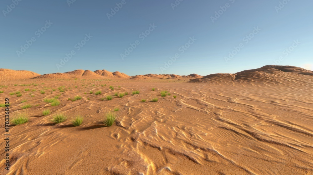 Naklejka premium Desert Landscape with Sand Dunes and Sparse Green Vegetation Under Clear Blue Sky