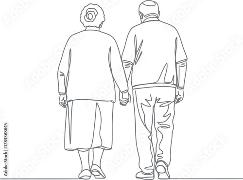 Elderly couple holding hands walking together forever