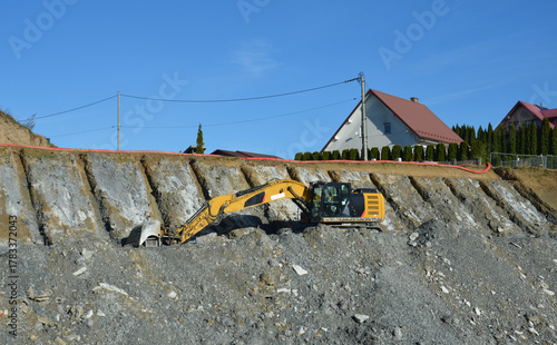 Installation of ground anchors on a mountain slope – slope stabilization and reinforcement works during railway line construction. Visible drilling rigs, steel anchors lk104.