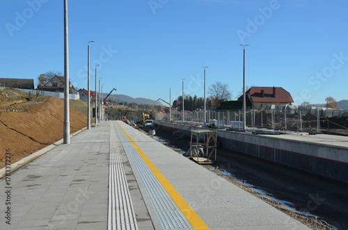 Fototapeta Naklejka Na Ścianę i Meble -  Construction of railway line No. 104 in the mountains – visible earthworks, slope reinforcements, and engineering structures under construction.