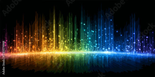Abstrakcyjny wizualny pokaz kolorowych świateł i refleksów na czarnym tle, symbolizujący energię.