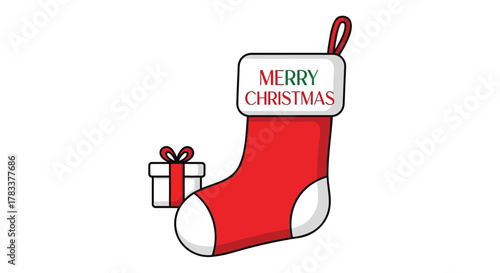 A festive red christmas stocking with merry christmas text and a small gift box on a white background