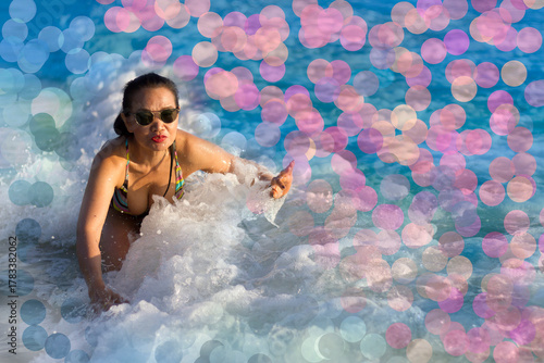 Woman in swimsuit and bokeh on beach