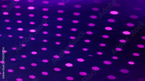 Vibrant light projection on a circus arena floor, creating a dynamic and captivating atmosphere. Ideal for concepts related to entertainment, circus, shows, and performances