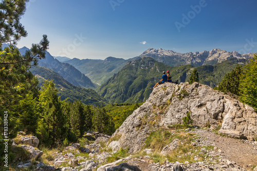 Two hikers in the Albanian Alps near Theth enjoying the scenery 