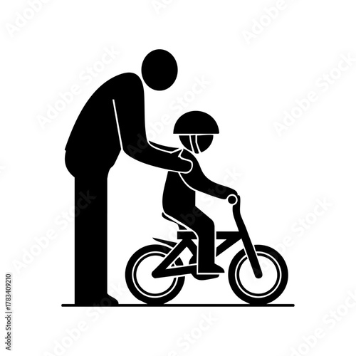 Parent helping a young child ride a bicycle while wearing a safety helmet, symbolizing learning, guidance, and safety.