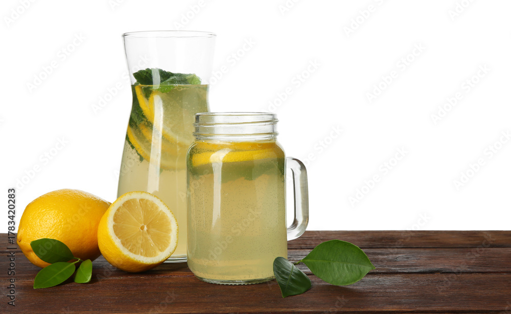 Fototapeta premium Tasty lemonade with mint and fresh fruits on wooden table against white background