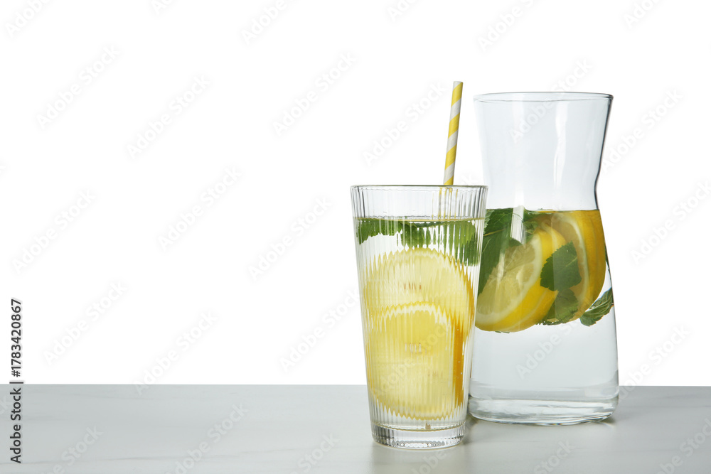 Fototapeta premium Refreshing water with lemon and mint on marble table against white background, space for text