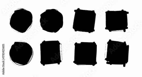 Collection of eight black grunge brush stroke shapes including ovals and rectangles on a white background