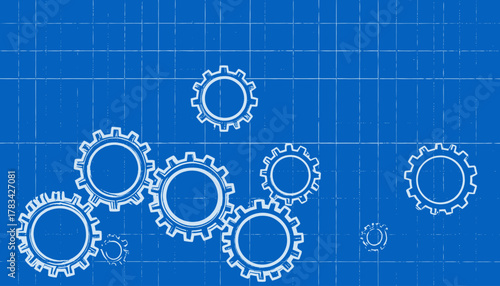 A blue-toned blueprint with various white gear outlines scattered across a grid