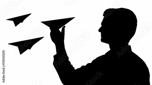 Dreamer launching paper airplanes into the future, embodying aspiration and innovative business leadership