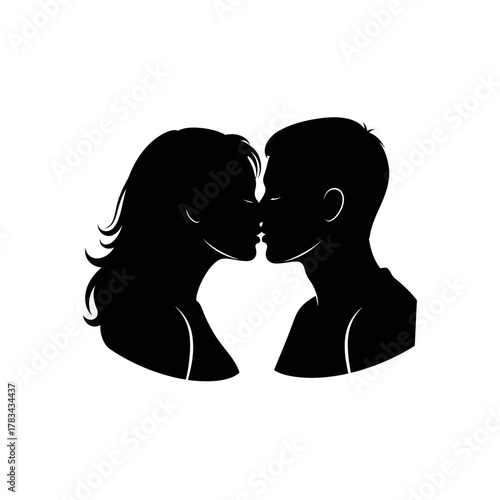 Silhouette of a man and woman kissing each other in a romantic embrace.