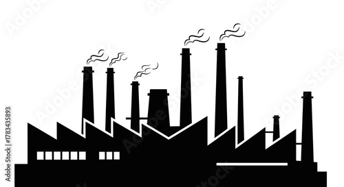 Industrial factory building silhouette with multiple smoking chimneys representing environmental pollution, manufacturing, global warming issues and energy production