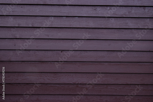 burgundy painted wood siding
