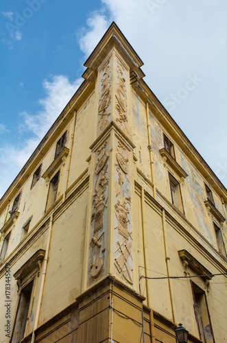16th century corner building in Palermo, Italy. Originally housing courts on upper floors & prison ground floor, repurposed as finance office 19th century, now abandoned. Neoclassical relief carvings