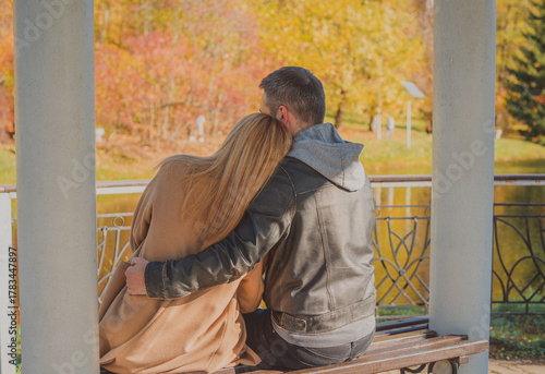 Elegant European couple walking together through picturesque city streets. Warm autumn light, gentle smiles, and cinematic vintage atmosphere 