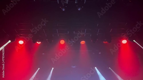 A theater stage illuminated with vibrant red spotlights. The lights create a dramatic atmosphere Stock Video