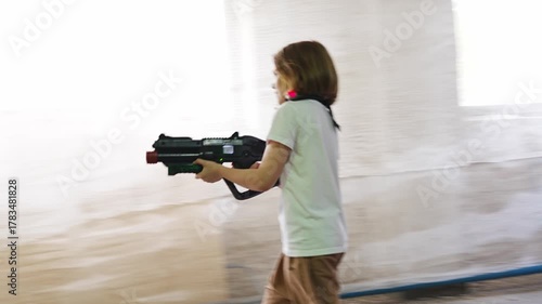 Children play in a fun laser tag game indoors