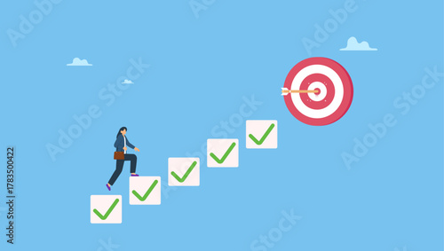 Smart businesswoman walk up checklist as staircase to achieve target. Personal development plan for career success, build specialist skill or competence to motivate and achieve business target.