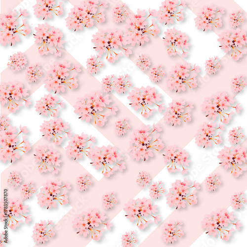 Pink cherry blossom flowers scattered on a light pink and white diagonal striped background