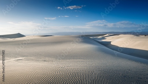 smooth undisturbed white sand dunes meeting the horizon line