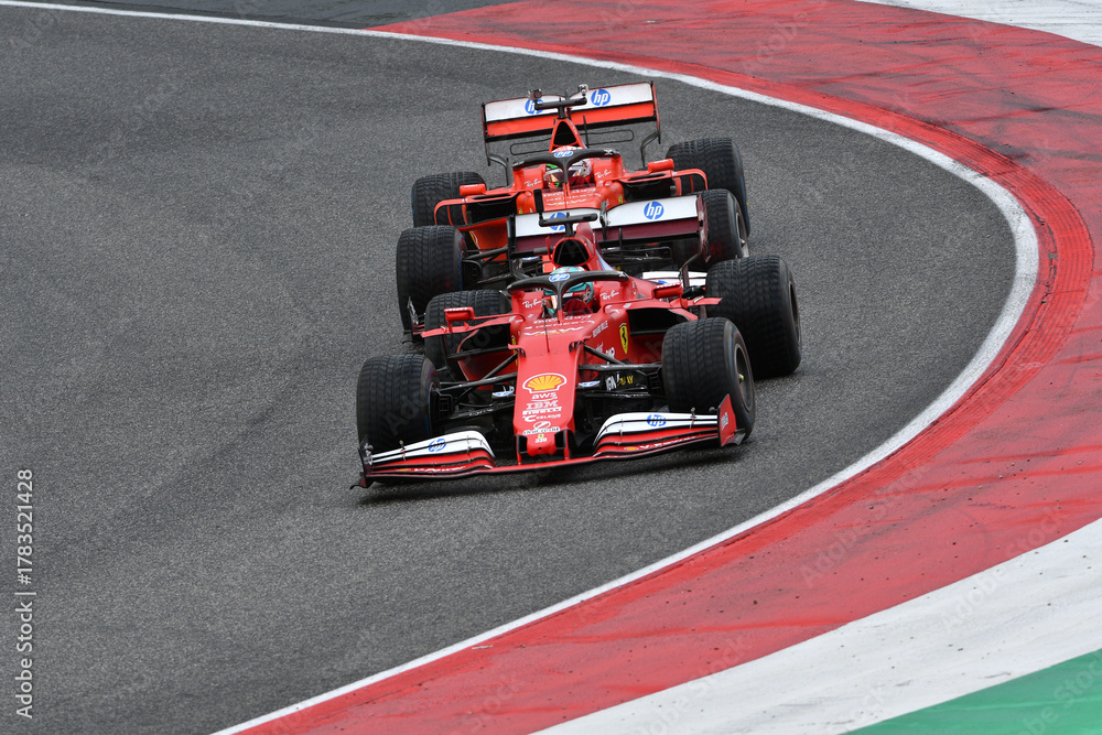 Obraz premium Scarperia; Italy - October 24th 2025: Ferrari SF1000 ex Sebastian Vettel and Charles Leclerc in action during Ferrari World Finals 2025 at Mugello Circuit in Italy.