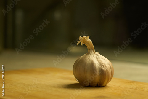 Garlic on the wooden board in kitchen