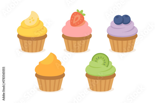 Colorful fruit flavored cupcakes with frosting and paper liners isolated on white