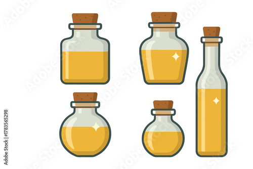 Set of various glass bottles and jars containing golden oil or potion sealed with cork stoppers