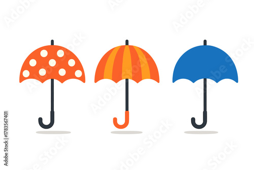 Three brightly colored open umbrellas featuring polka dots, stripes, and solid blue designs