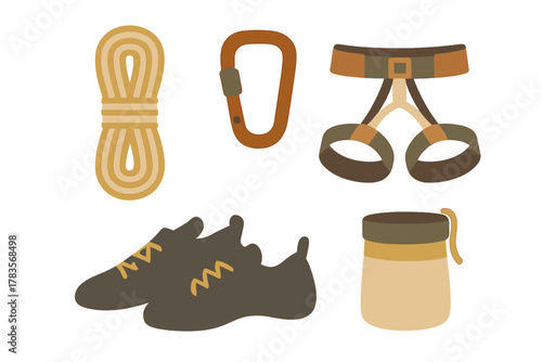 Essential rock climbing equipment set including safety harness, coiled rope, carabiner, shoes, and chalk bag
