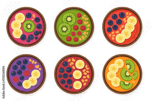 Variety of healthy breakfast bowls with fruit toppings including kiwi, banana, and berries