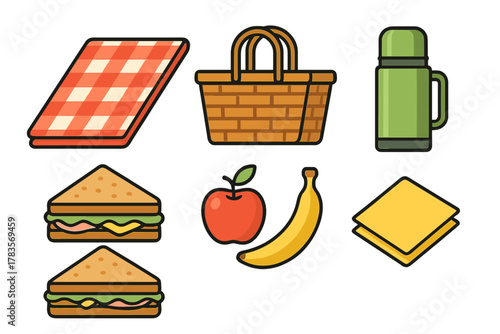 Wicker basket, checkered blanket, thermos, sandwiches, and fresh fruit for an outdoor picnic