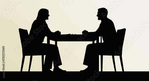 Two people silhouetted at a table, discussing documents