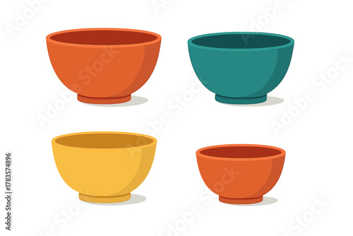Set of four colorful empty ceramic serving bowls in various sizes and vibrant colors isolated on white