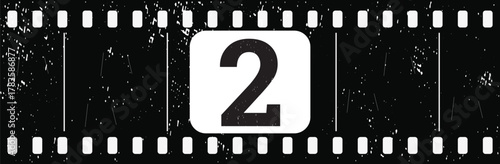 Vintage filmstrip countdown frame number 2 with grunge texture on transparent background
