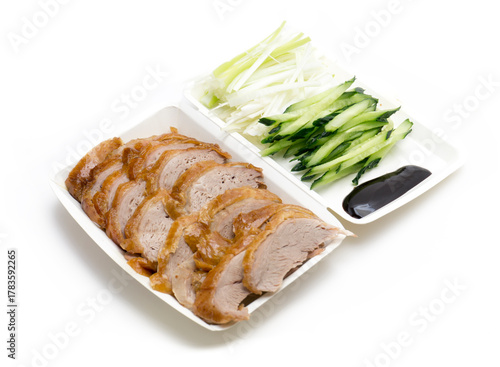 Traditional Peking Duck Slices with Cucumber, Scallion, and Sweet Bean Sauce on White Isolated Background – Chinese Cuisine