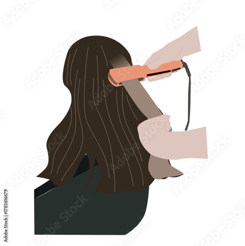 woman straightening hair at salon
