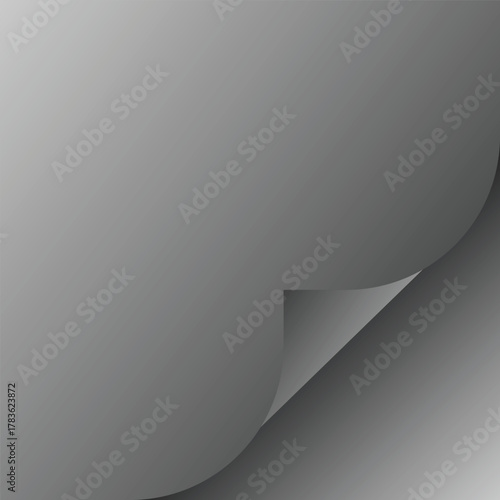 Curled corner of a transparent sheet of paper or material