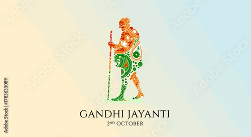 Vibrant and artistic vector silhouette of Mahatma Gandhi, adorned with intricate paisley patterns in saffron, white, and green, symbolizing the Indian flag, commemorating Gandhi Jayanti on October