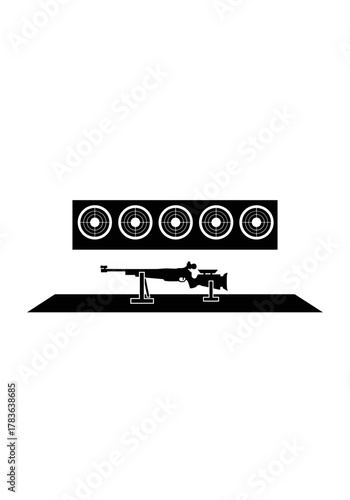 Shooting range setup with air rifle and target boards in background  