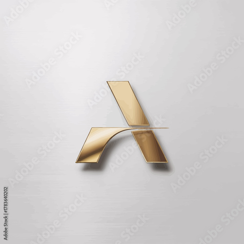 This image depicts a sleek, golden logo against a brushed metallic surface, showcasing a sophisticated and luxurious aesthetic perfect for branding and corporate identity.