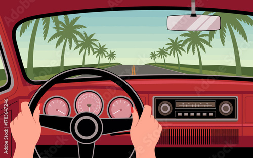 A scenic view from the driver's perspective, showcasing a picturesque road flanked by tall palm trees, evoking a sense of adventure and travel into nature.